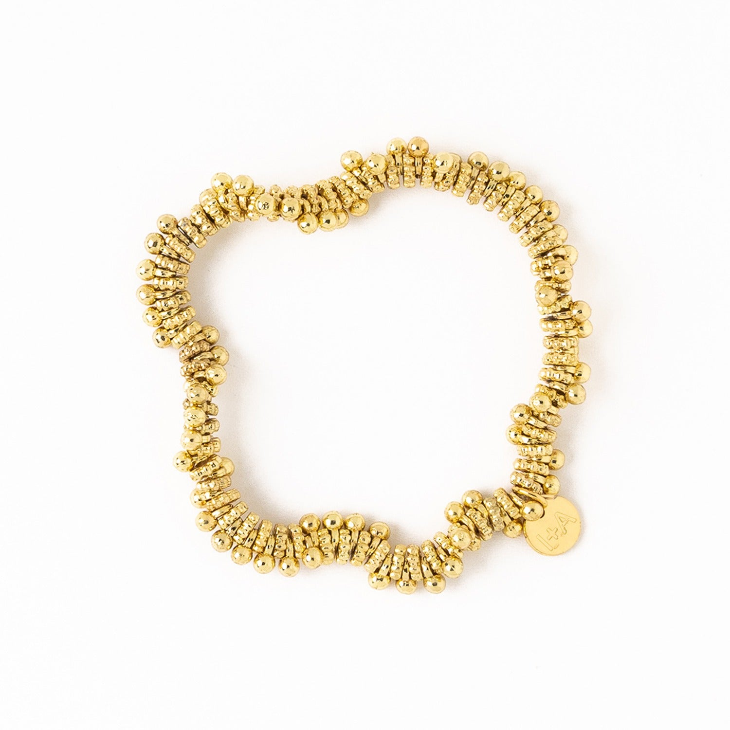 Kate Brass Round + Flat Bead Stretch Bracelet by Ink & Alloy