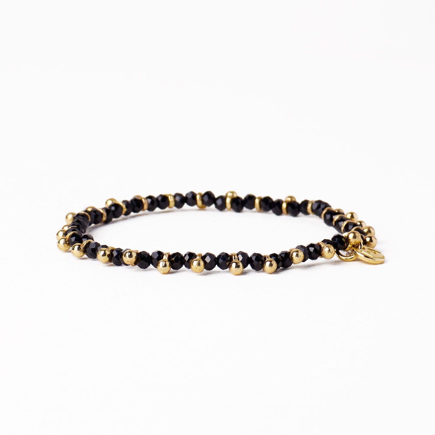 Kami Crystal + Brass Charm Stretch Bracelet in Black + Gold by Ink & Alloy