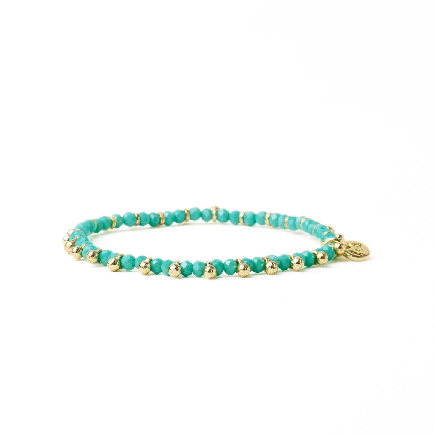 Kami Crystal + Brass Charm Stretch Bracelet in Teal + Gold by Ink & Alloy